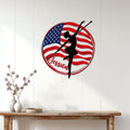 American flag baton twirling wall sign displayed on a light wood-paneled wall above a console table