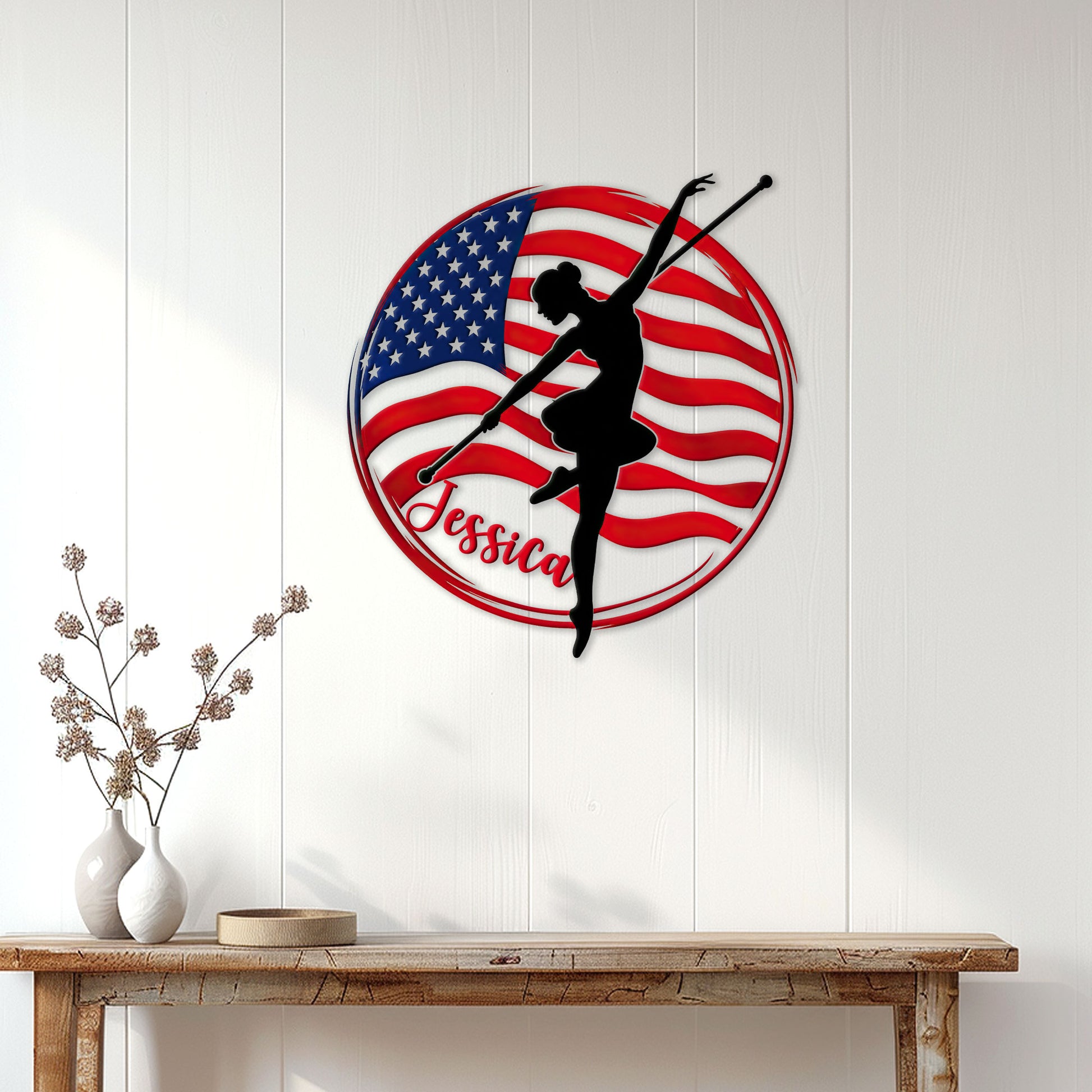 American flag baton twirling wall sign displayed on a light wood-paneled wall above a console table