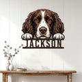 English Springer Spaniel metal sign displayed on a white paneled wall above a rustic console table