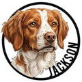 Brittany Spaniel metal sign featuring a detailed chestnut-and-white dog portrait in a circular black frame