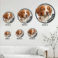 Brittany Spaniel metal sign size guide showing multiple circular sign sizes displayed on a living room wall