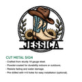 Cut metal cowgirl sign showcasing western boots and a cowboy hat framed by sunflower accents