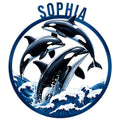 Circular orca metal sign featuring three leaping killer whales rising through stylized blue ocean waves