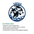 Orca cut metal sign showcasing three breaching killer whales and curling ocean waves