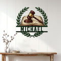 Law office wall decor displayed above a console table, featuring a gavel and law book in a laurel frame