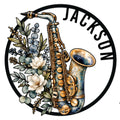 Floral saxophone metal sign with a detailed brass instrument in a circular wall decor design