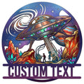 Colorful UFO metal sign featuring an alien encounter, cosmic sky, planets, crystals, and dramatic mountain scenery