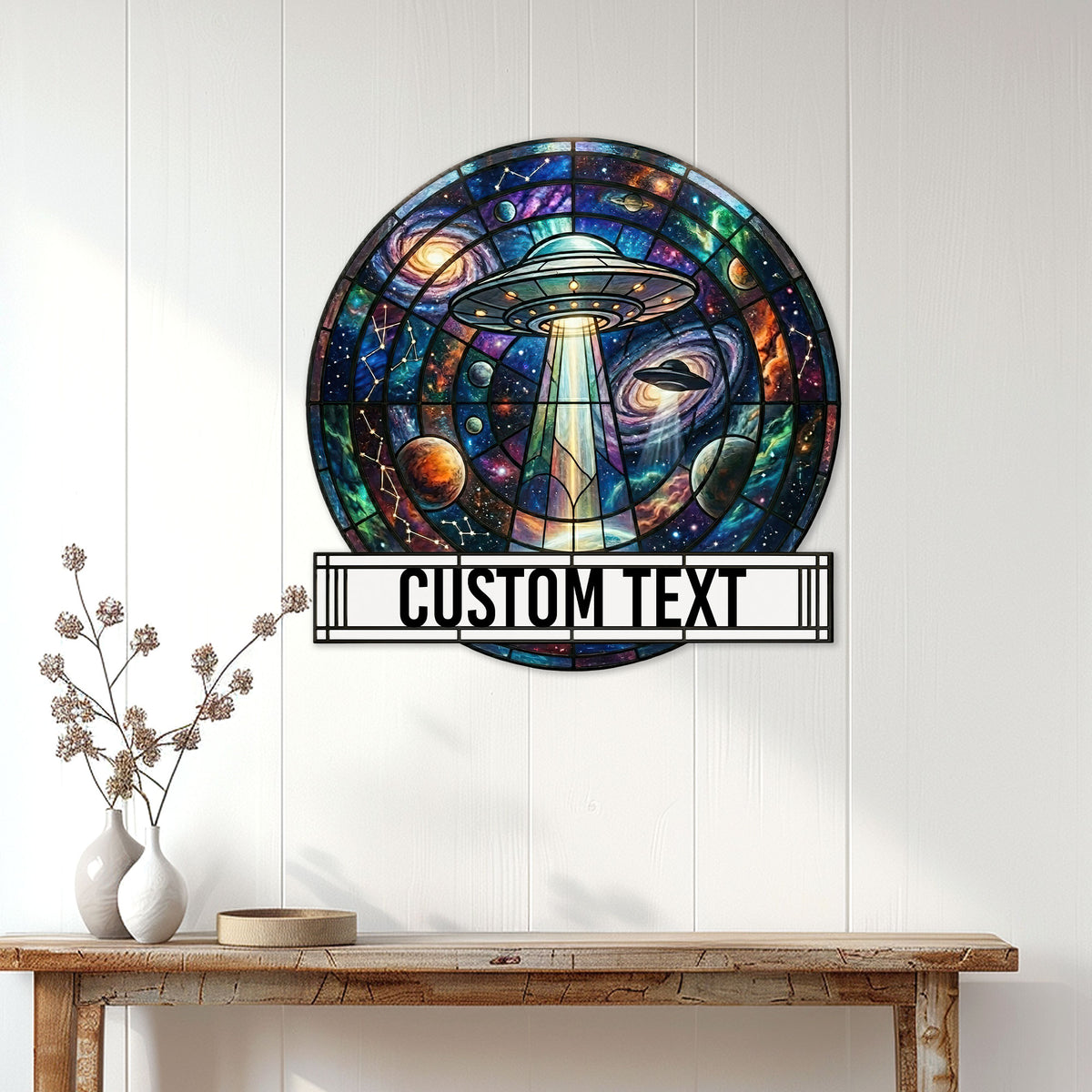 UFO wall sign displayed above a console table, featuring a glowing saucer beam and vibrant galaxy scene