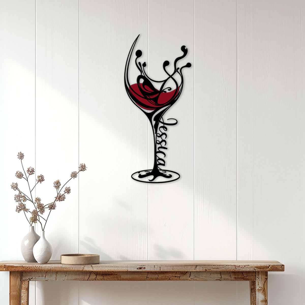 Ornate wine glass metal wall decor displayed on a bright paneled wall above a console table