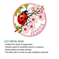 Ladybug cut metal sign shown with a flowering branch design and illustrated product features for indoor or outdoor display