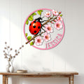 Ladybug wall sign displayed above a console table, bringing colorful spring garden decor to a bright interior