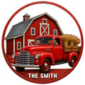 Round farm truck metal sign featuring a vintage red pickup, classic red barn, wheat bundles, and rustic wood-look border