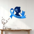 Blue Sign Language awareness wall sign displayed on a light wood-paneled wall in a home