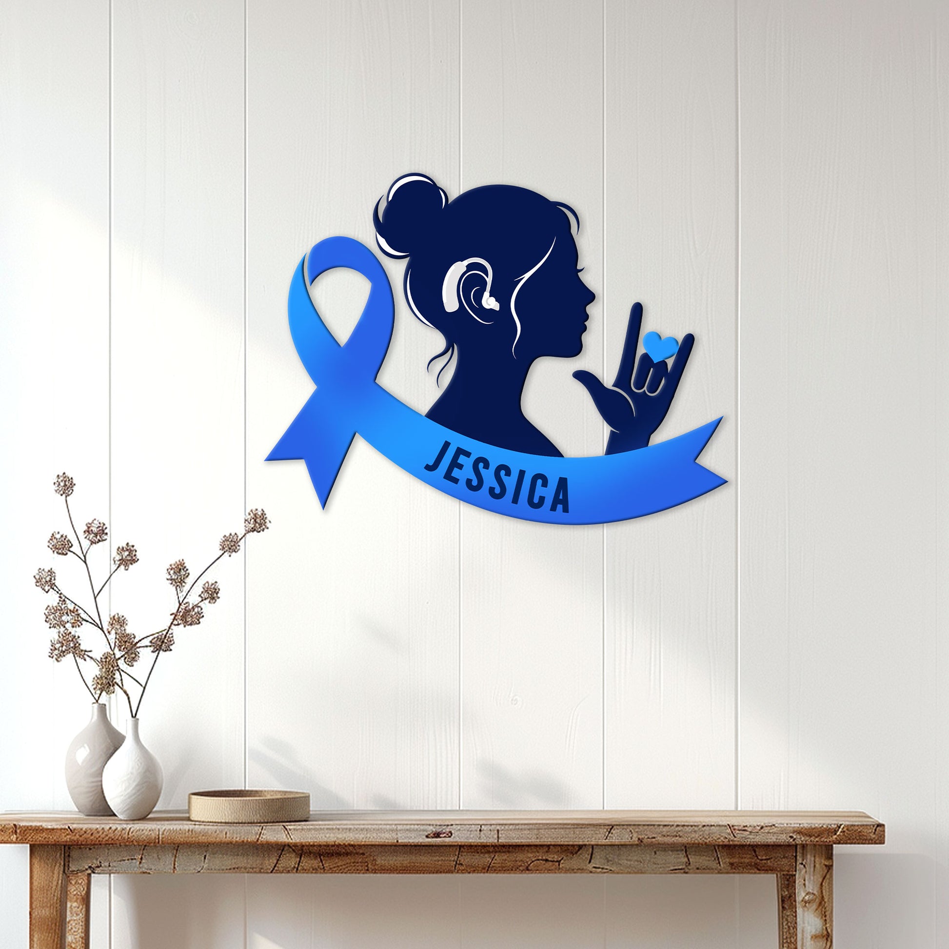 Sign language awareness metal sign displayed on a light wood wall above a console table