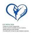 Blue heart-shaped metal sign featuring a baton twirler silhouette in an energetic performance pose