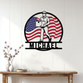 Patriotic mail carrier metal wall sign displayed on a light wood wall in a home entryway