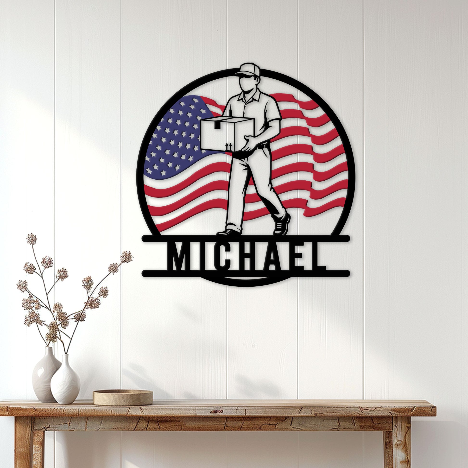 Patriotic mail carrier metal wall sign displayed on a light wood wall in a home entryway