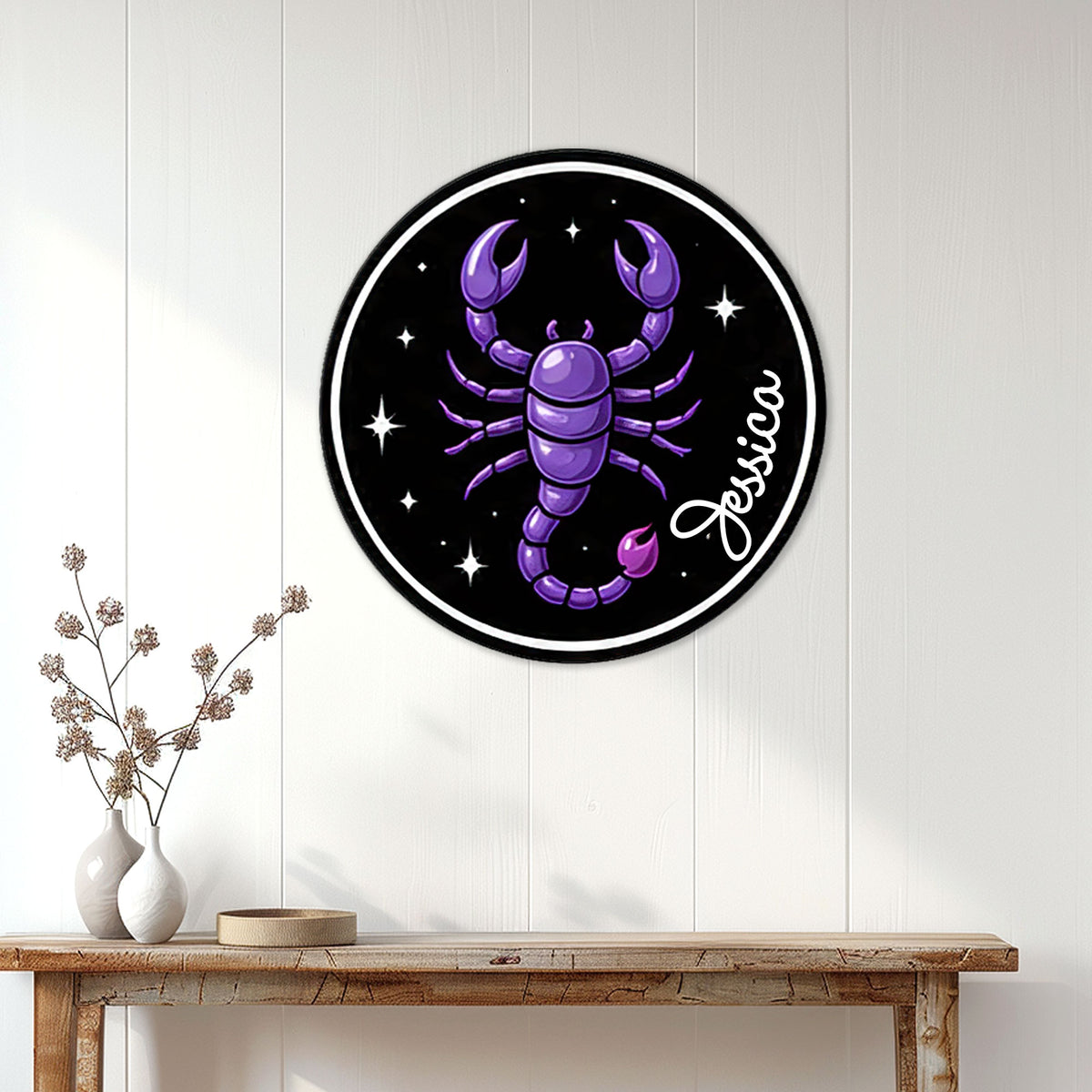 Purple Scorpio zodiac metal sign displayed on a white paneled wall above a console table