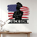 Patriotic chef metal sign displayed on a white paneled wall as kitchen and home decor