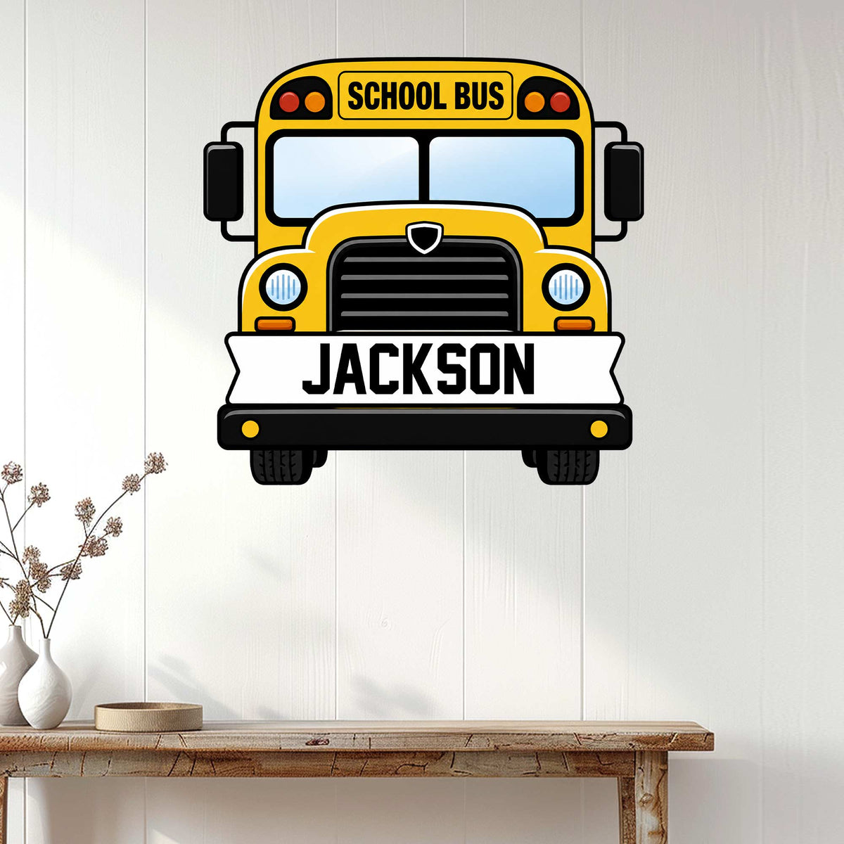 Custom school bus wall sign displayed above a console table in a bright, white-paneled room