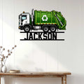 Green recycling garbage truck wall sign displayed in a bright home interior above a console table