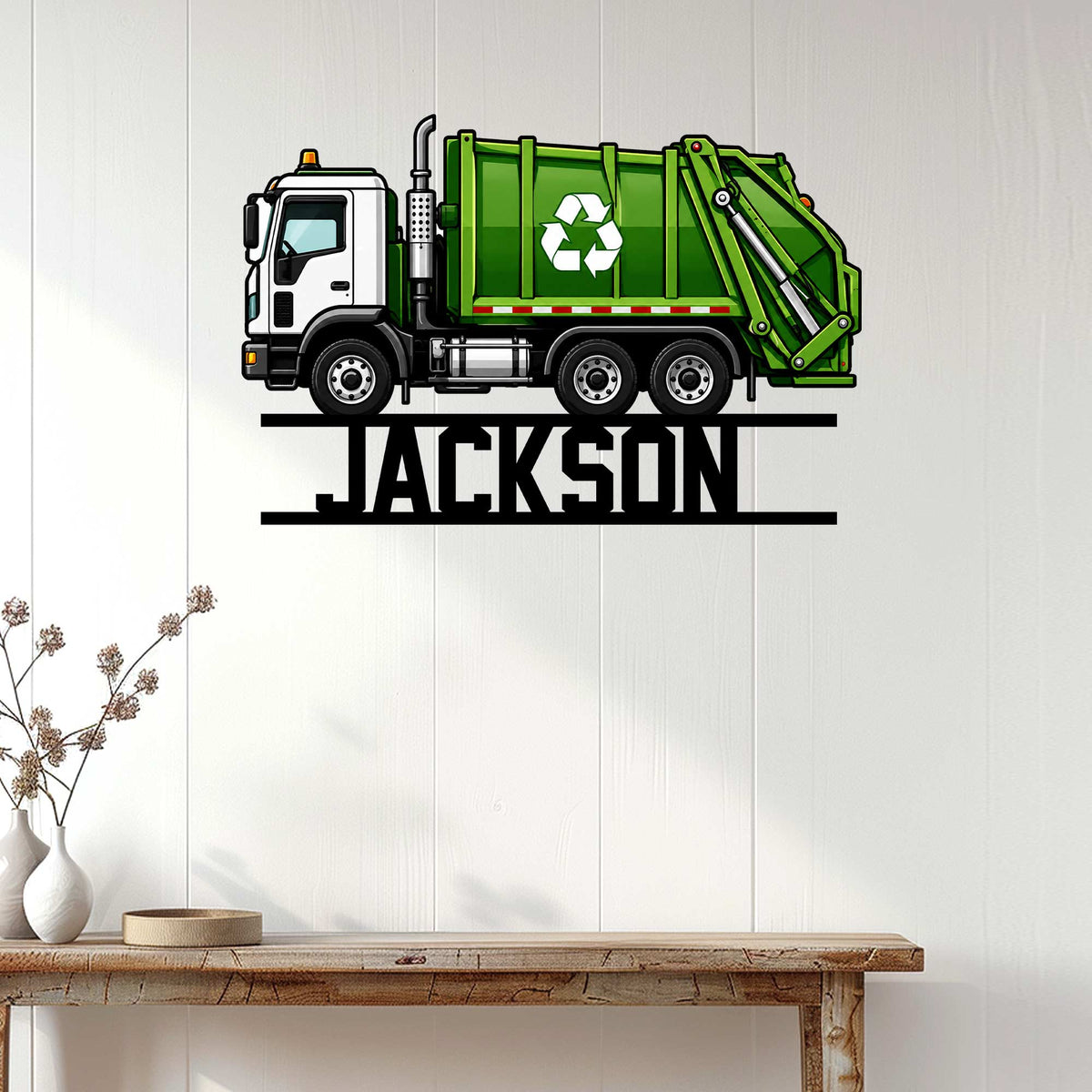 Green recycling garbage truck wall sign displayed in a bright home interior above a console table