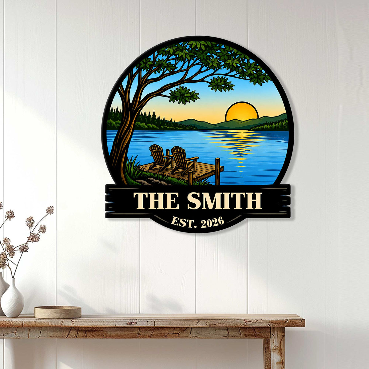 Lake house wall decor displayed on a white paneled wall, featuring a sunset lake and peaceful dock scene