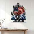 Nautical anchor wall sign displayed on a light wood wall above a console table in a coastal home setting
