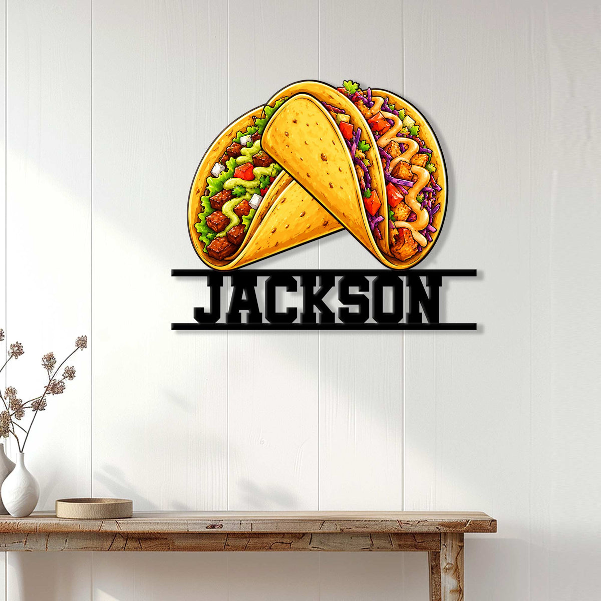 Taco wall decor displayed on a light wood-paneled wall above a console table
