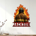 Firefighter wall sign displayed on a light wood-paneled wall above a console table