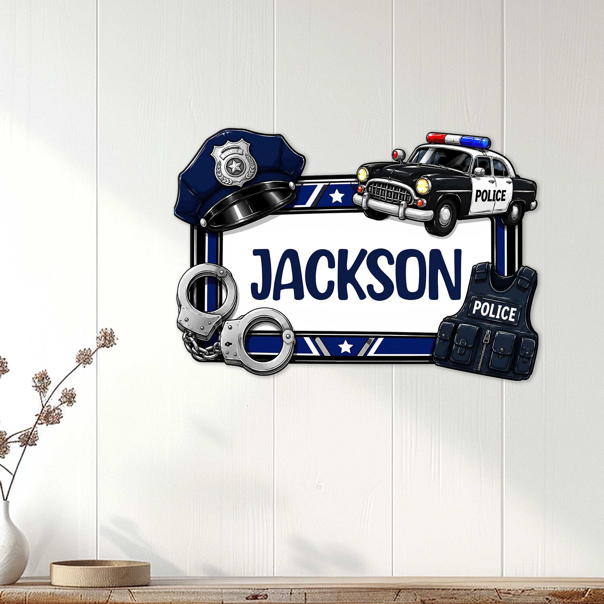 Police-themed metal wall sign displayed on a light wood wall with a badge, patrol car, and law enforcement gear