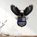 Police wall decor displayed on a white paneled wall, featuring an eagle and thin blue line shield