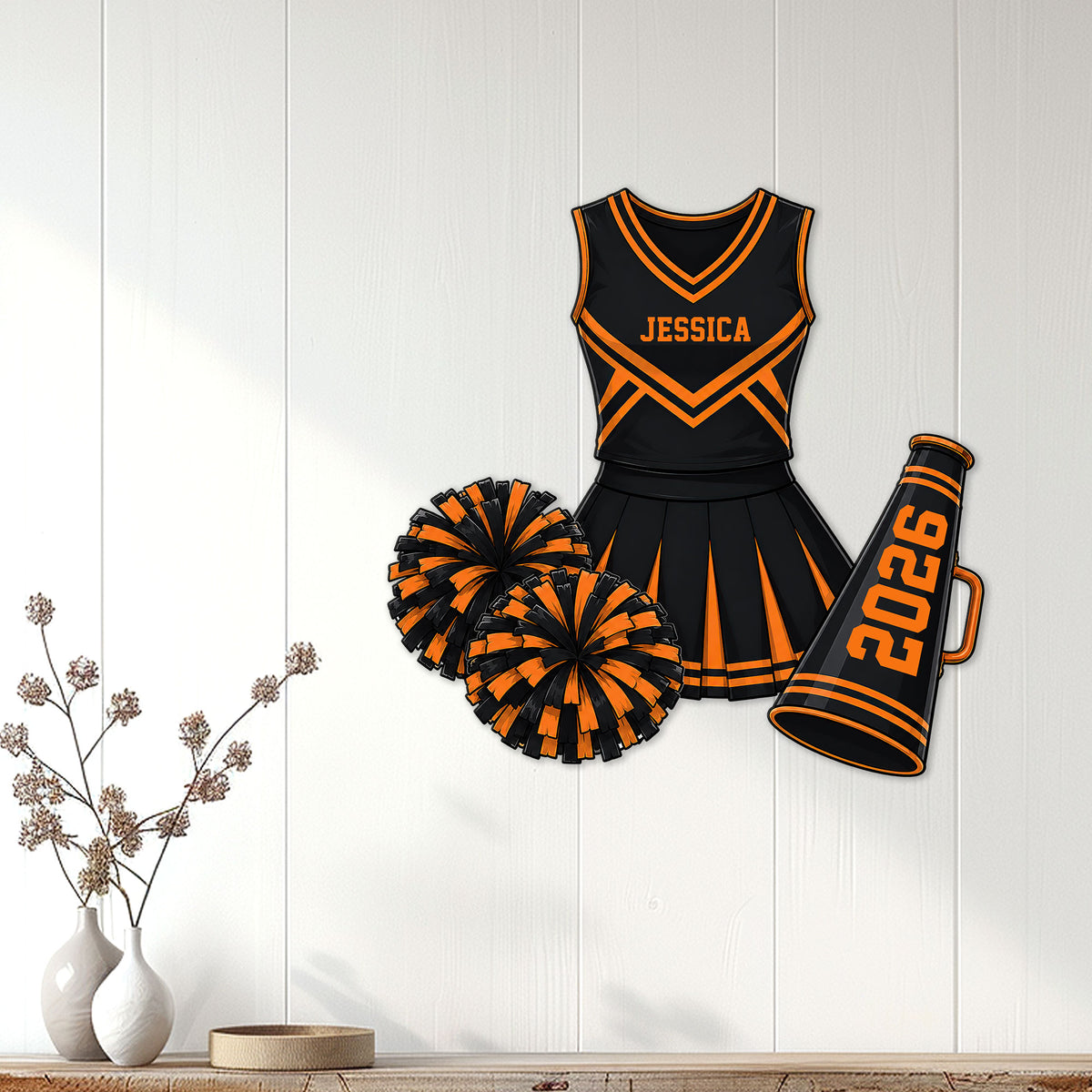 Black and orange cheerleading uniform metal sign styled as wall decor