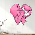 Pink boxing glove and breast cancer ribbon metal sign displayed as wall decor in a bright room