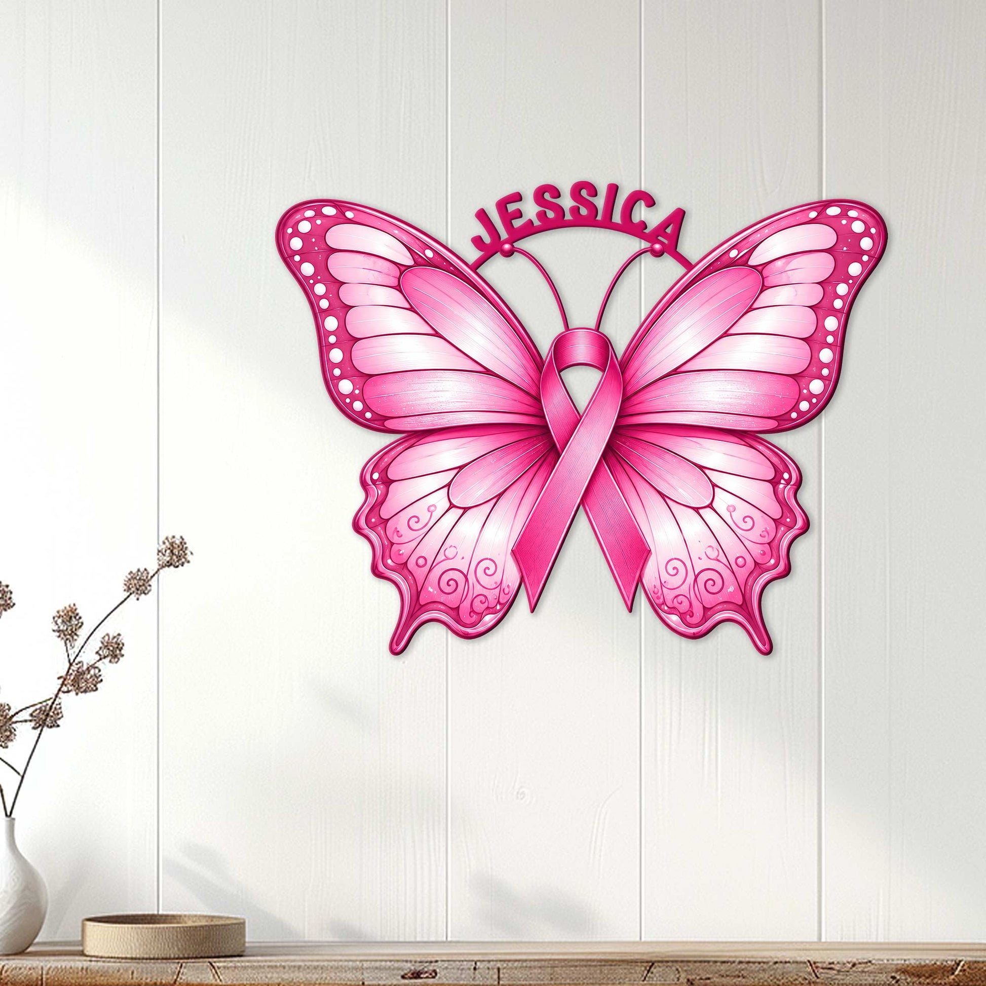 Pink butterfly breast cancer ribbon wall sign displayed on a light wood-paneled wall