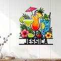 Tropical cocktail wall sign displayed on a light wood wall with margarita, fruit drinks, flowers, and greenery