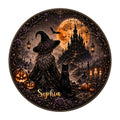 Round Halloween metal sign featuring a witch, black cat, pumpkins, bats, and a haunted castle under an orange moon
