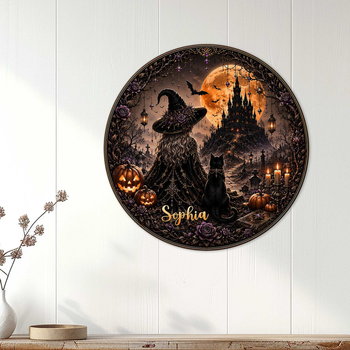 Gothic Halloween metal sign displayed on a white paneled wall with a witch, black cat, pumpkins, and haunted castle