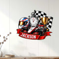 Racing wall sign displayed on a light wood-paneled wall with a formula car and checkered flag