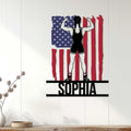 Patriotic women's wrestling wall sign displayed on a light wood-paneled wall in a home decor setting