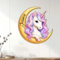 Rainbow-maned unicorn crescent moon wall sign displayed on white paneled interior decor