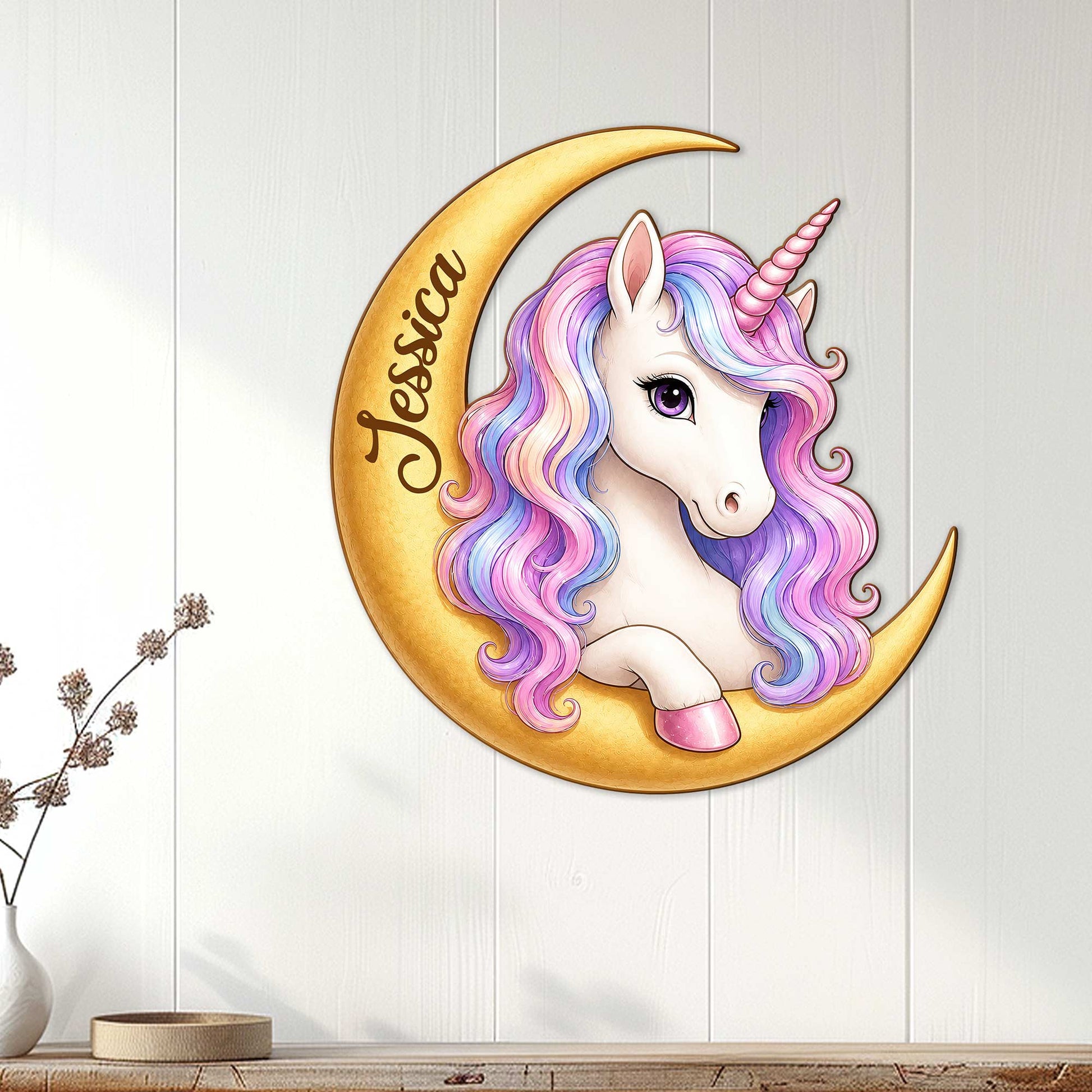 Rainbow-maned unicorn crescent moon wall sign displayed on white paneled interior decor