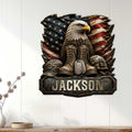 Veteran metal sign displayed on a light paneled wall with an eagle, American flag, boots, and military gear