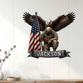 Patriotic military wall sign displayed on a light wood-paneled wall with a soldier, eagle, and American flag