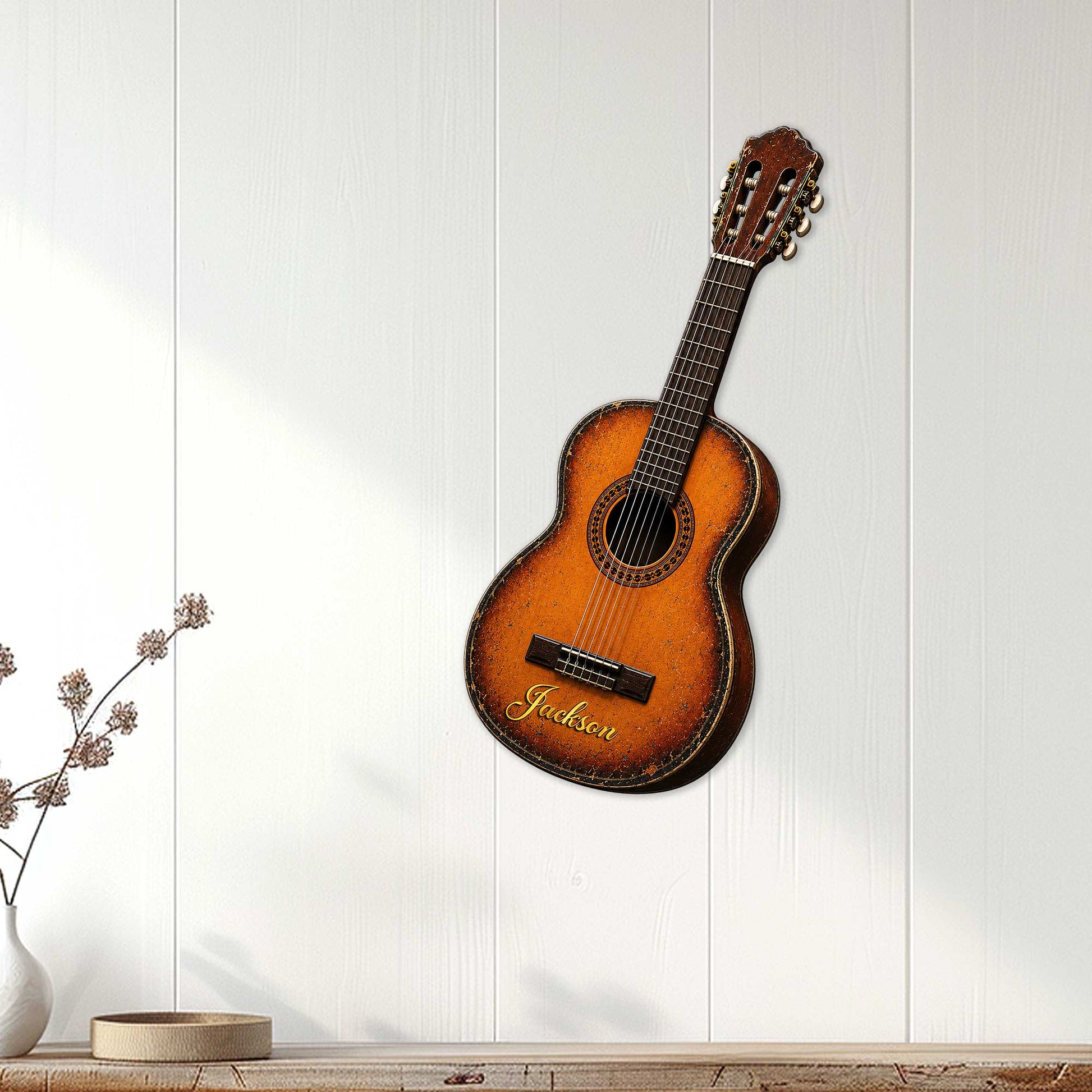 Guitar-shaped metal wall sign displayed on white paneled decor in a bright living room