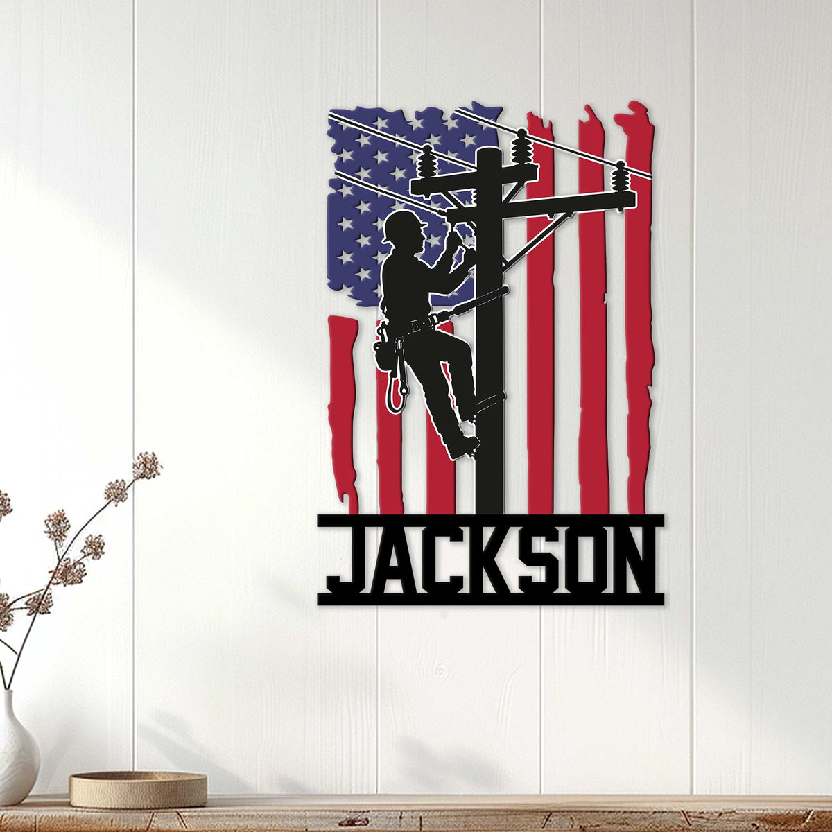 Patriotic lineman wall sign displayed on a white wood-paneled wall in a home decor setting