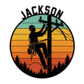Lineman metal sign featuring a power line technician climbing a utility pole against a colorful sunset