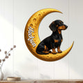 Dachshund moon wall decor displayed on a white paneled wall in a cozy home setting