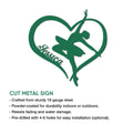 Green heart-shaped ballet sign with a graceful ballerina silhouette and cut-metal sign feature details