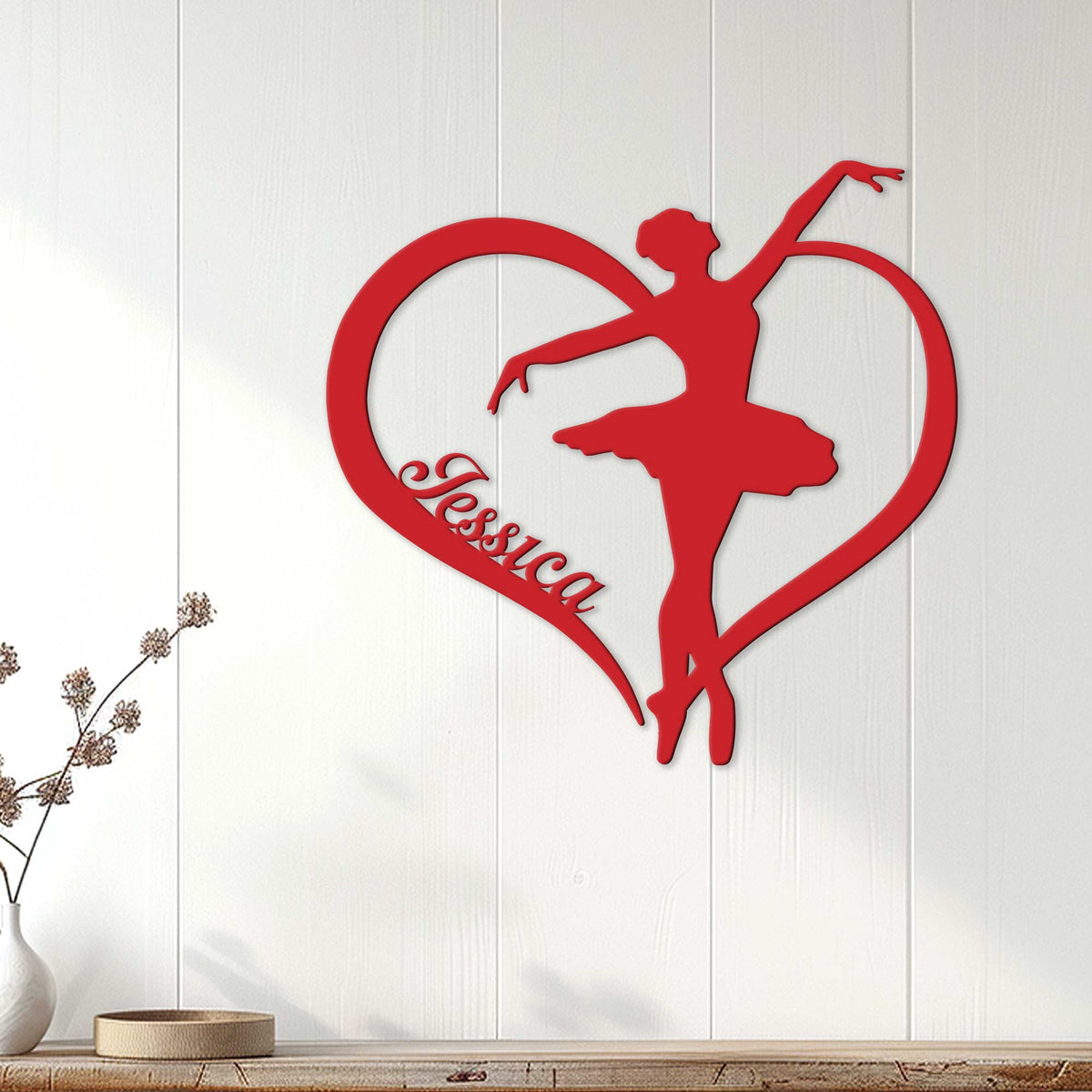 Red heart-shaped ballerina metal sign styled as elegant wall decor in a bright living space